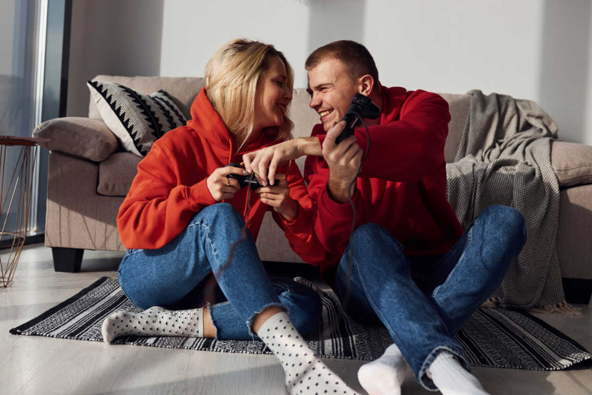 couple playing video games together couple playing video games together