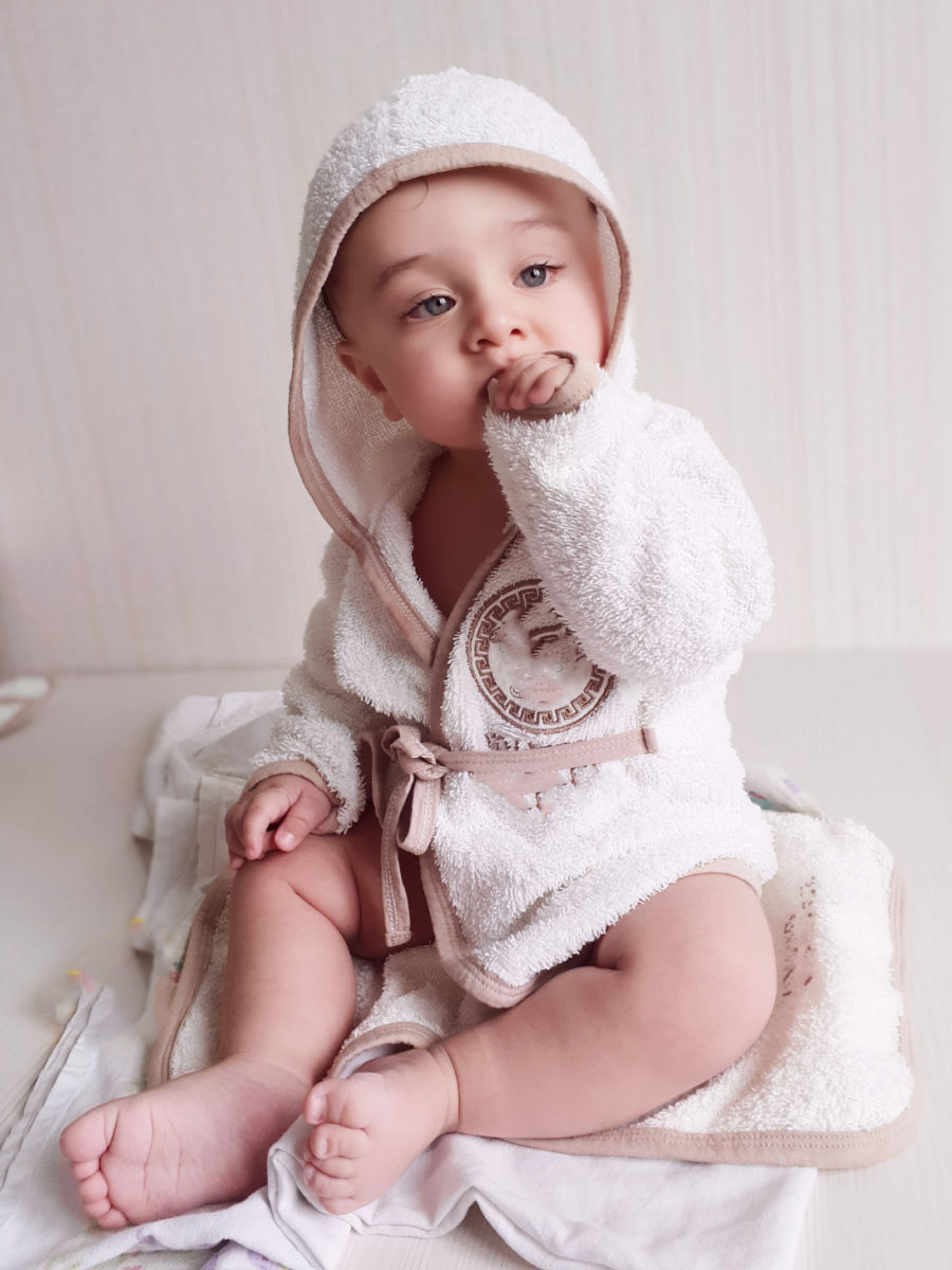 Baby in a hooded towel