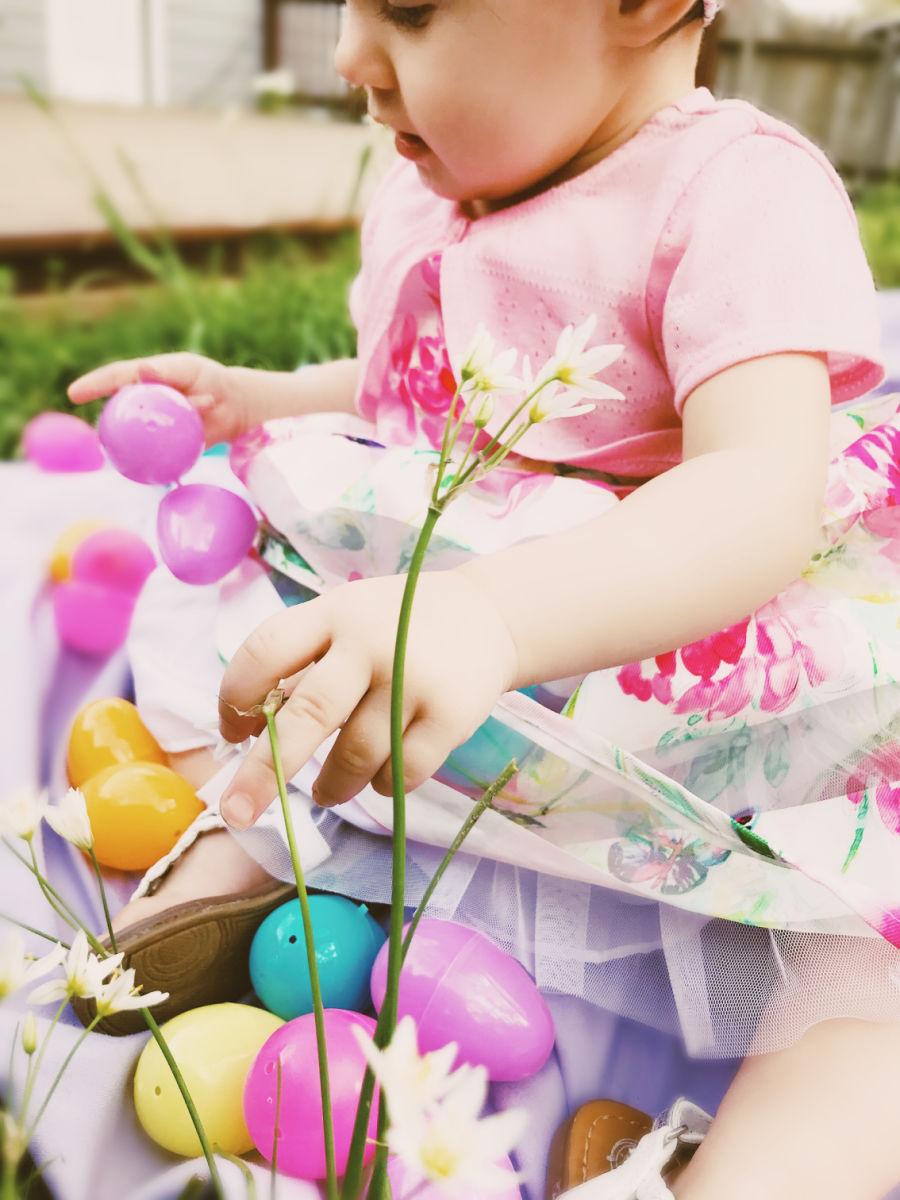 Baby with plastic Easter eggs