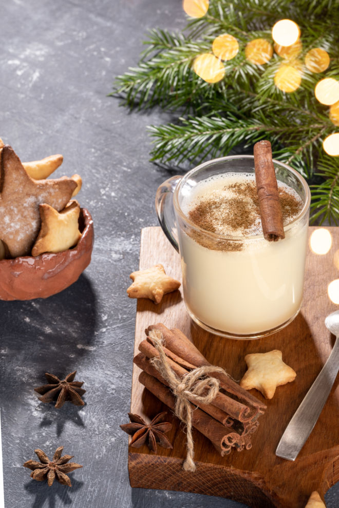 Homemade eggnog with cinnamon sticks
