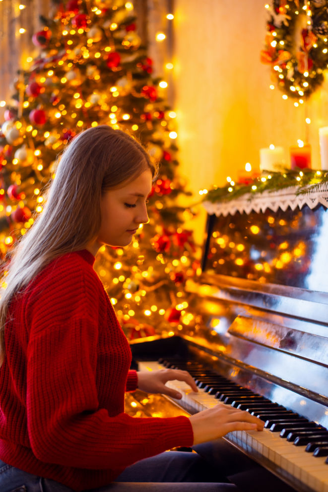 Playing piano and singing Christmas carols