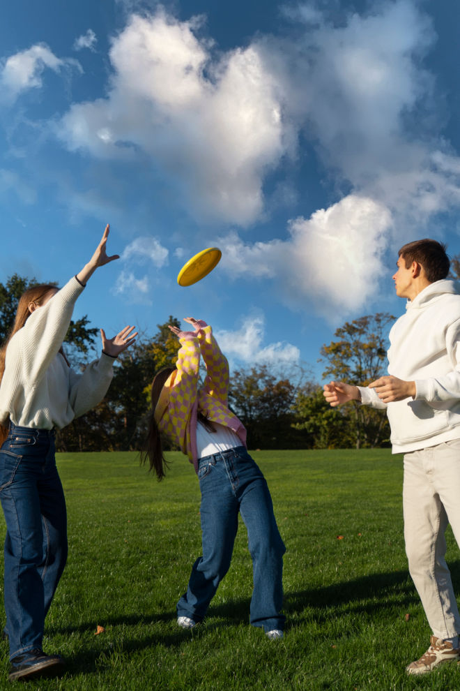 Teenagers playing frisbee