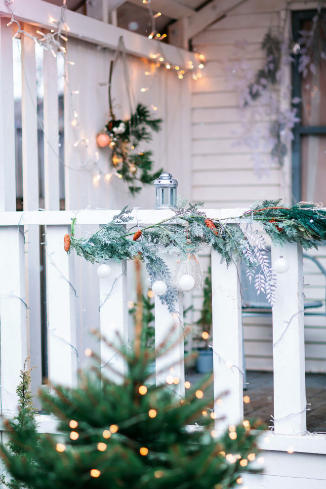Garland and lights draped around railings